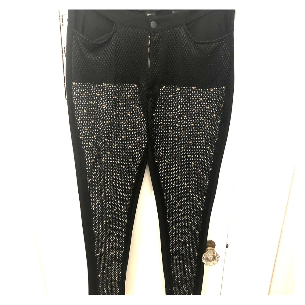 Black leggings with metal detail.